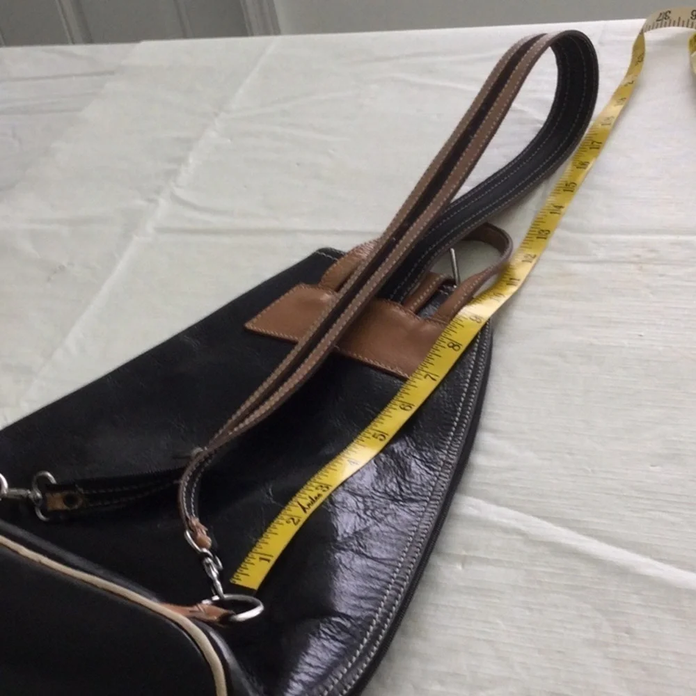 Woman’s Bag Style by Vera Pelle Shoulder Strap zips to convert to a Backpack.